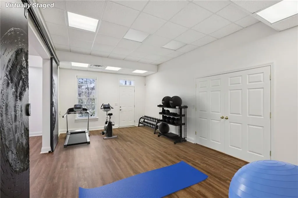 Exercise area featuring a paneled ceiling