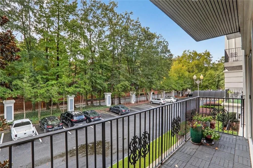 Balcony featuring view of scattered trees