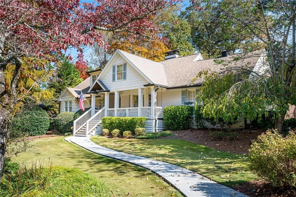 Inviting home featuring a porch swing and a beautifully decorated entry