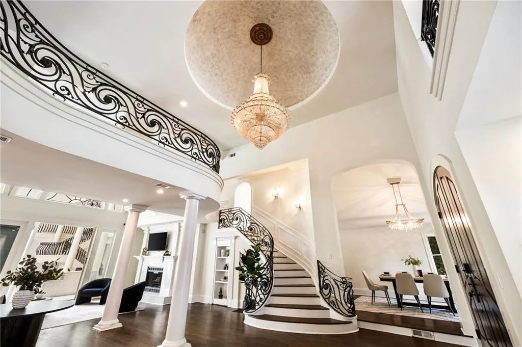 Community lobby with stairway, recessed lighting, and a towering ceiling