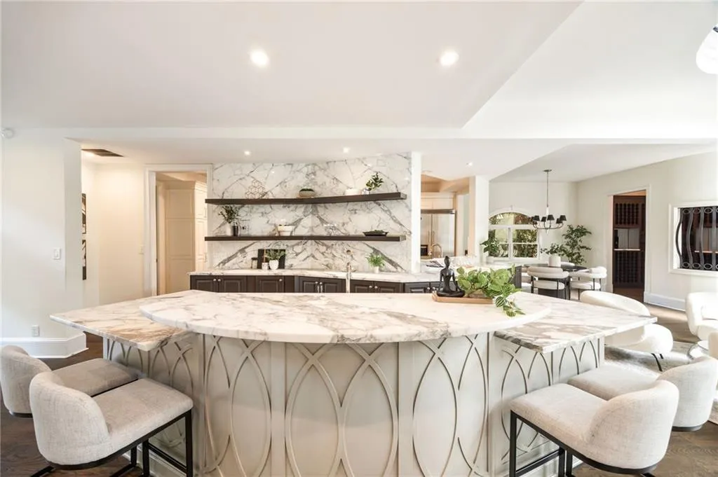 Bar with open shelves, light stone countertops, hanging light fixtures, tasteful backsplash, and dark wood finished floors