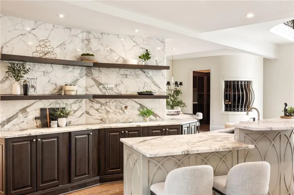 Bar area with open shelves, light stone counters, decorative backsplash, dark brown cabinetry, and recessed lighting