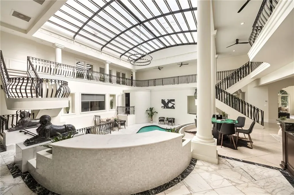 Community lobby with a towering ceiling and stairway