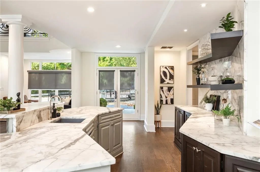 Kitchen featuring light stone counters, dark wood finished floors, recessed lighting, and open shelves