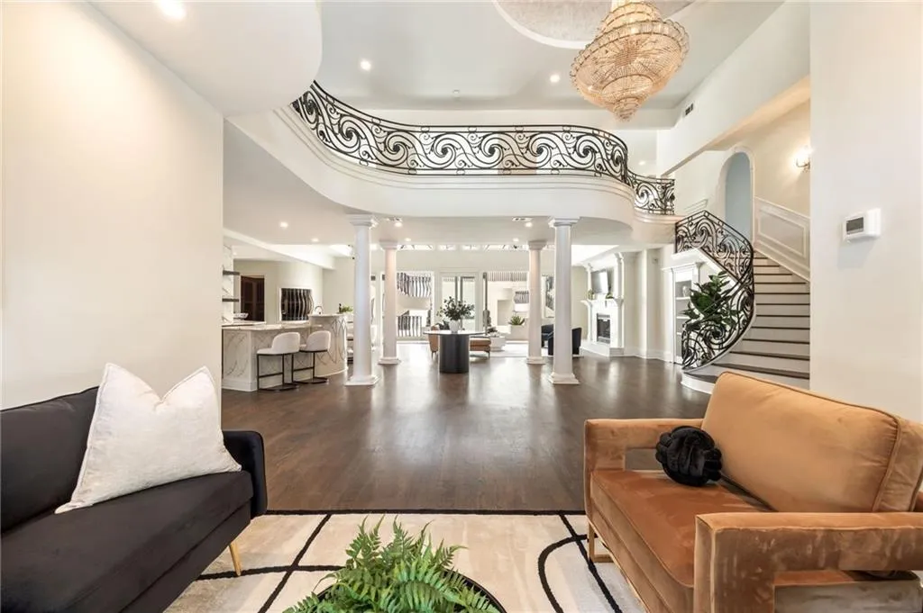 Building lobby featuring recessed lighting, stairs, and a high ceiling