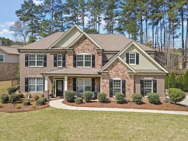 Brick and Stone Front of Home with Cover Porch