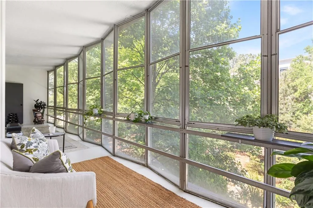 30 FEET of windows span the entire unit with so much natural light and the absolute best view of nothing but trees!