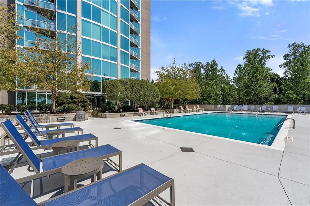 View of new swimming pool with a patio area