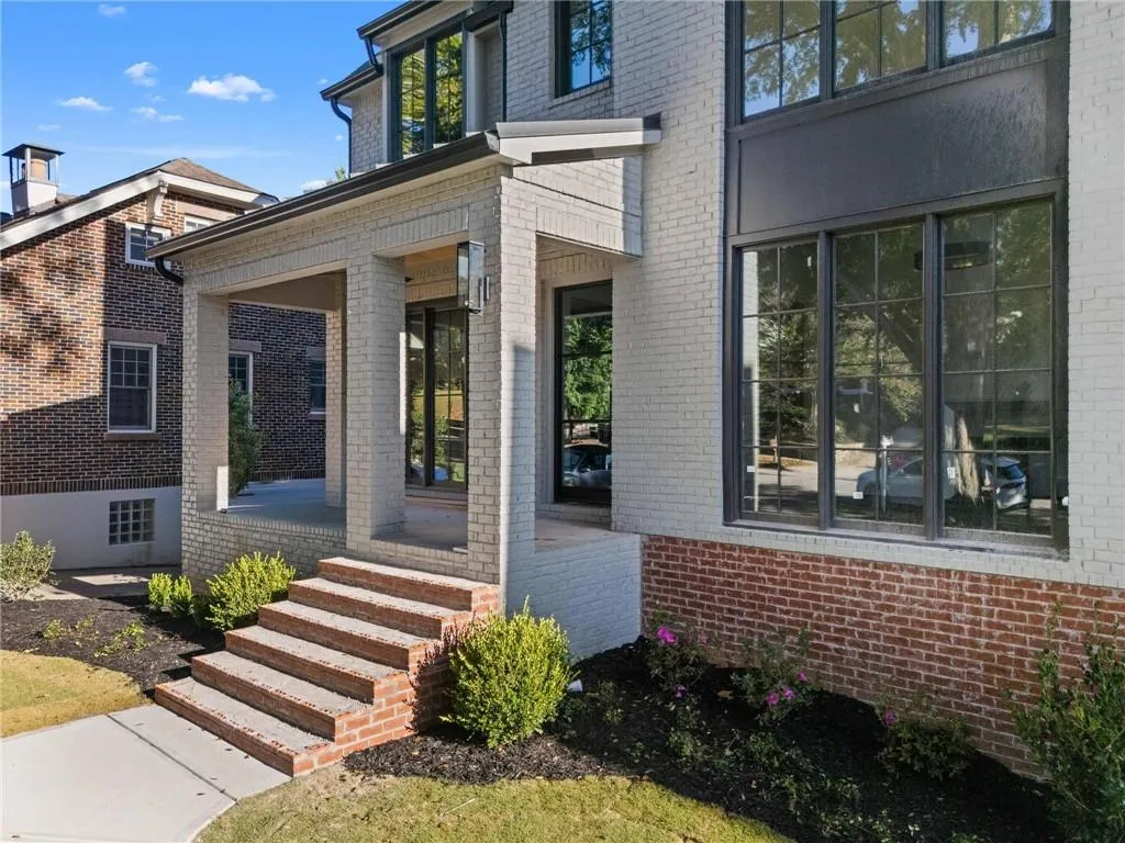 Entrance to property with brick siding