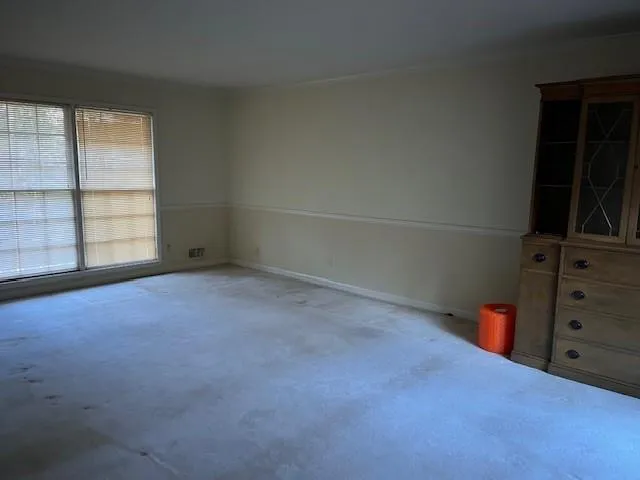 Large Formal Living Room With View of Side of Property and Woods!