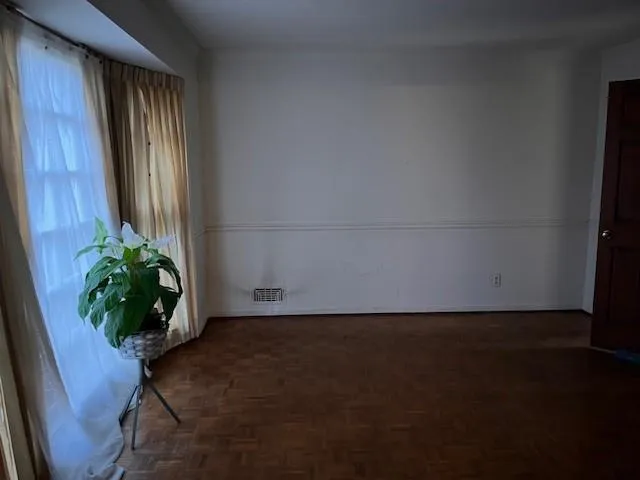 Formal Dining Room with Parquet Flooring