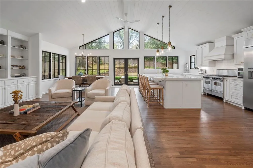 The large family room is perfect for entertaining or cozy quiet nights. The gorgeous bank of windows allow the inside and outside to flow seamlessly