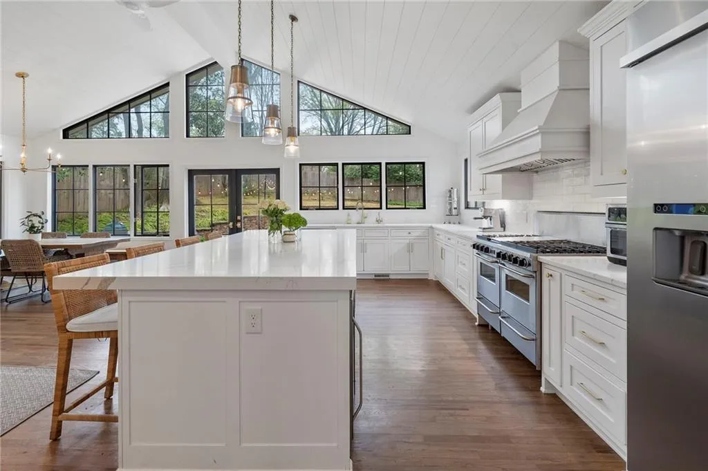 The kitchen island anchors the large kitchen - providing tremendous prep space, dining space, and/or serving space.