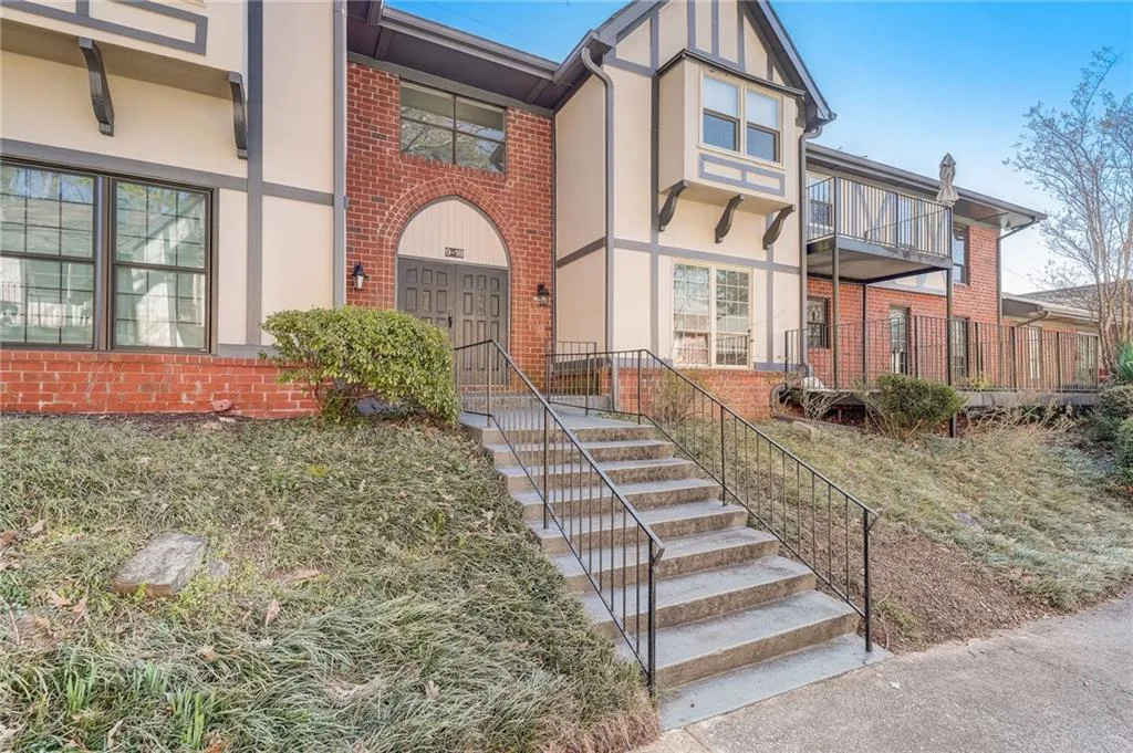 View of front of property with a balcony