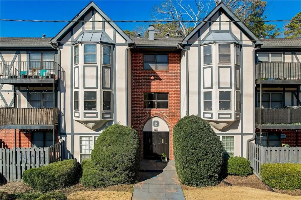 English style home featuring a balcony