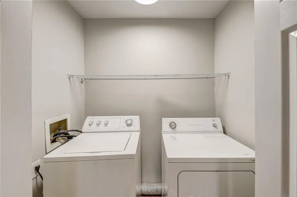 Laundry area featuring hookup for a washing machine and washing machine and dryer