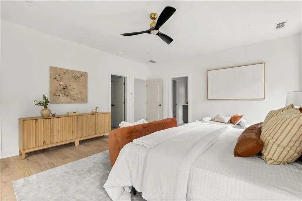 Bedroom with wood finished floors and ceiling fan
