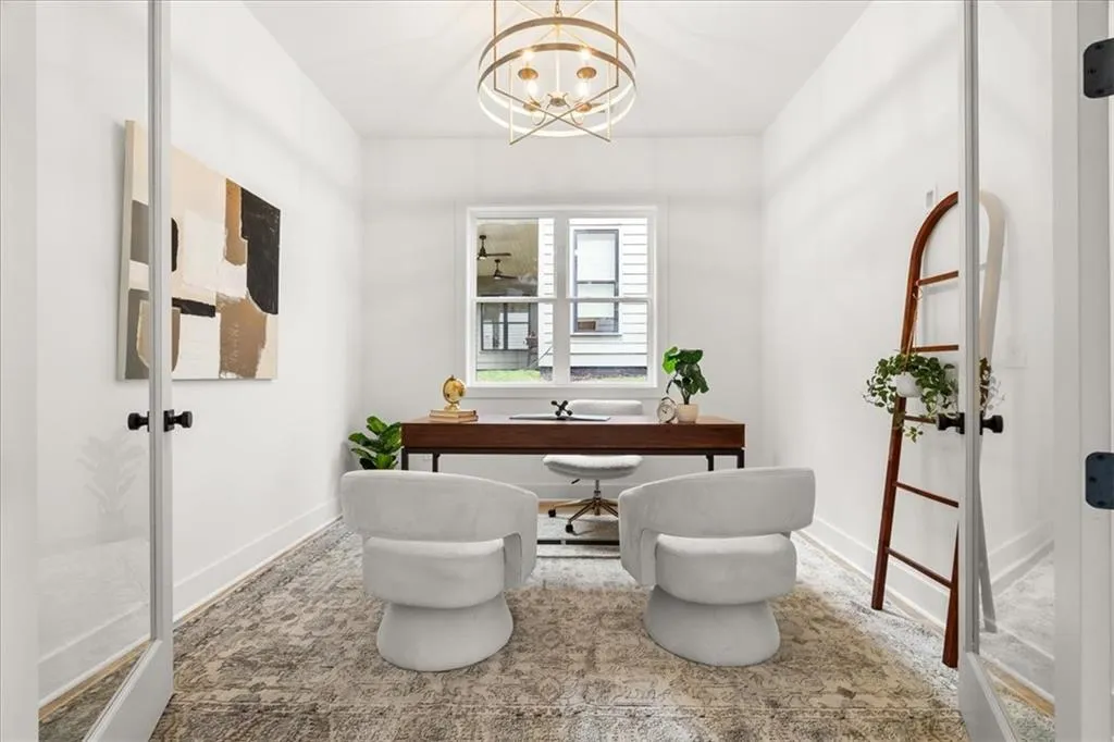 Office with a chandelier and french doors
