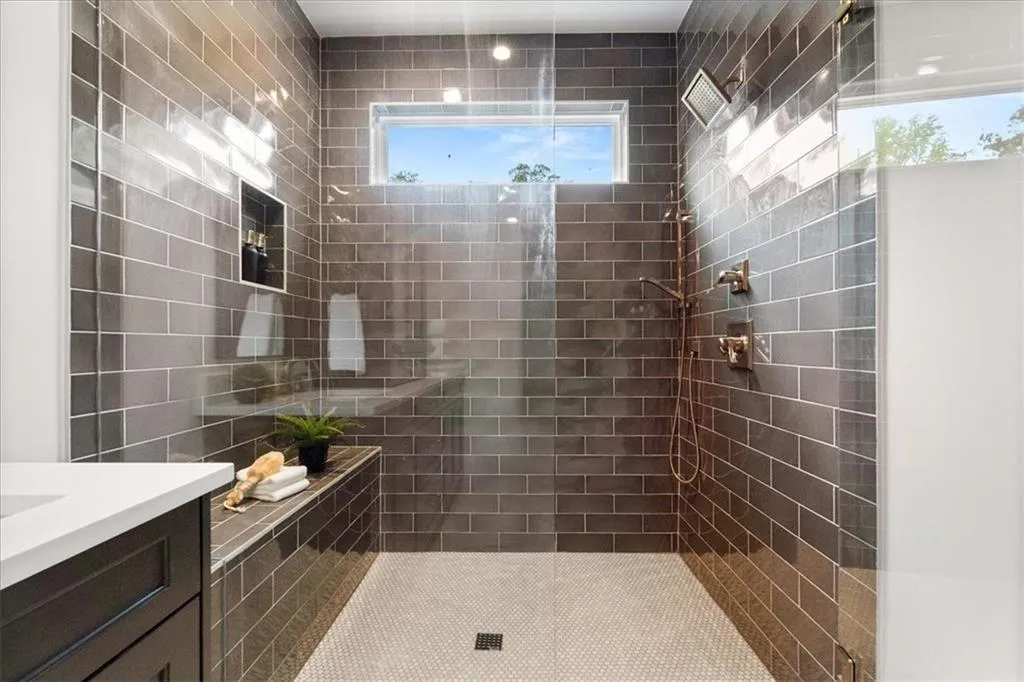 Full bath featuring a walk in shower and vanity