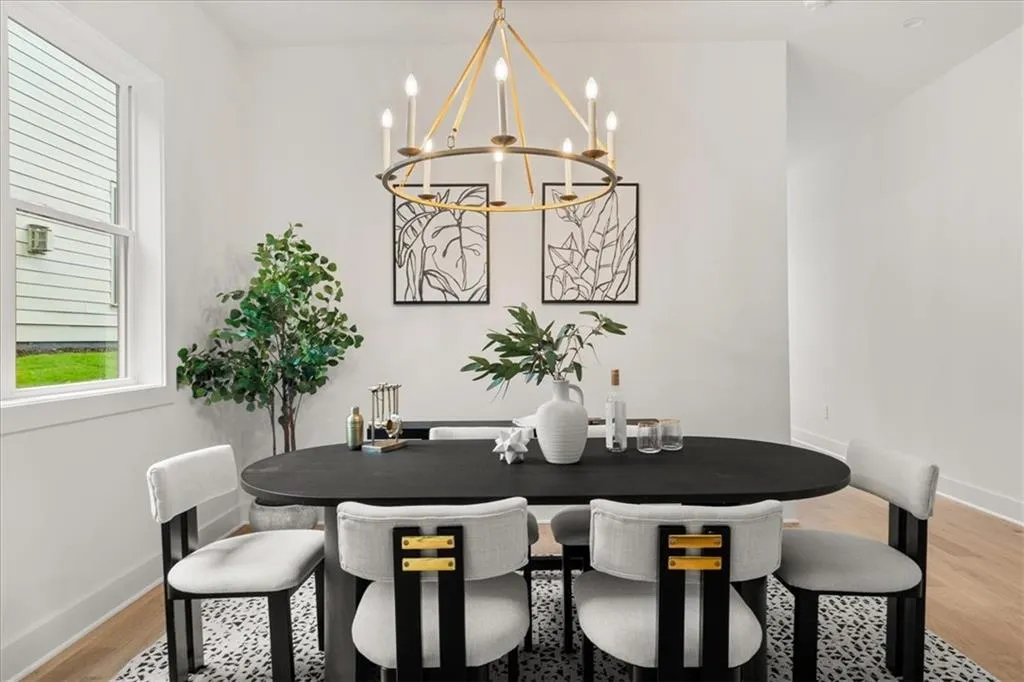 Dining area featuring light wood-style floors and a chandelier