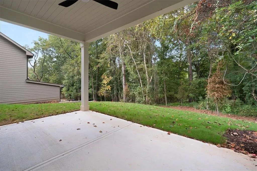 View of patio with a ceiling fan