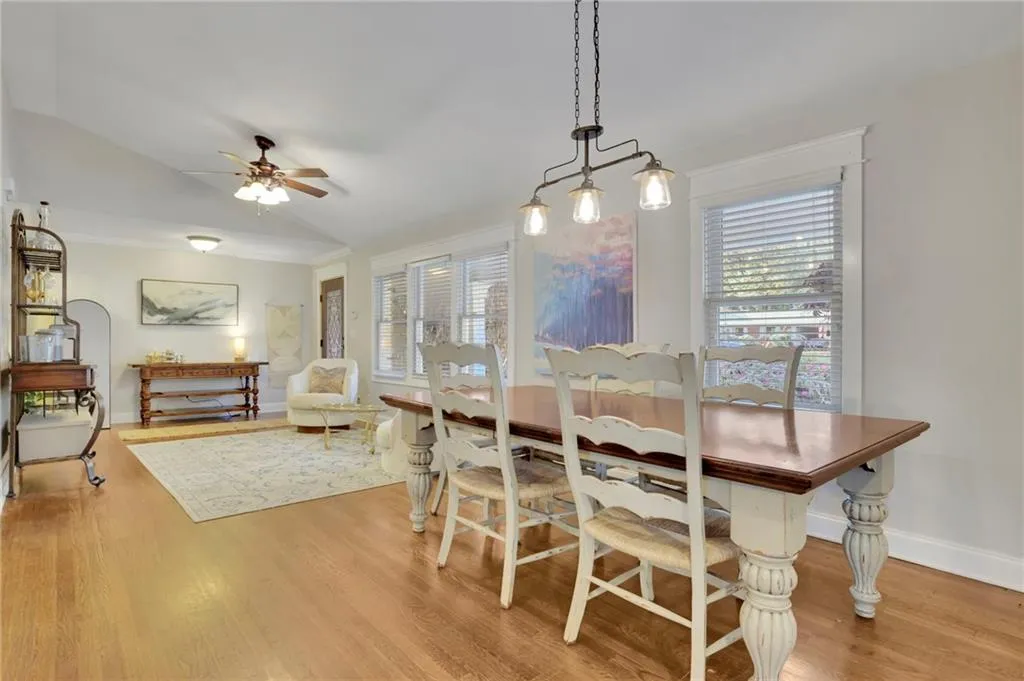 Dining area featuring light hardwood / wood-style floors, ceiling fan, and lofted ceiling