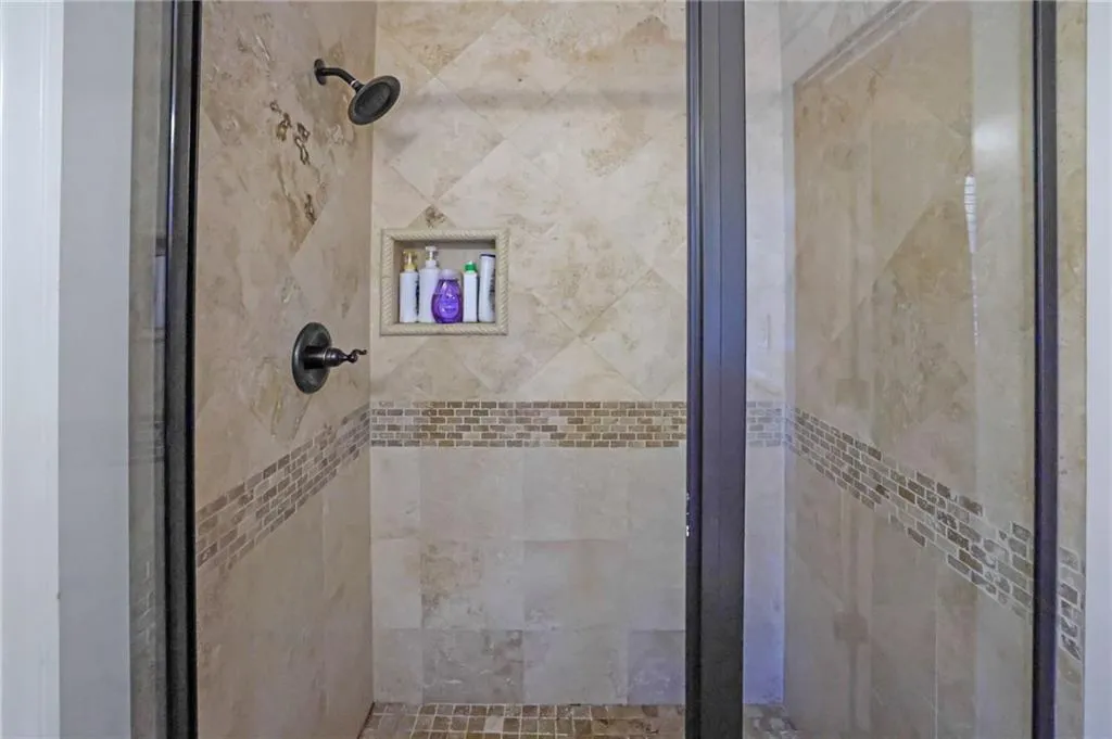Bathroom with a shower with door
