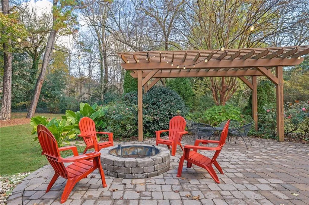 View of patio with an outdoor fire pit