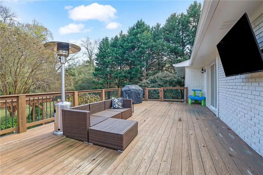Deck with grilling area and an outdoor living space