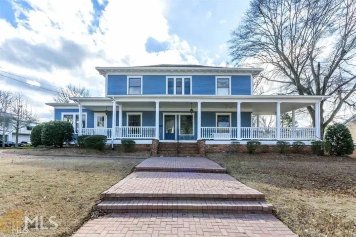 Two-story residence with blue siding and white trim