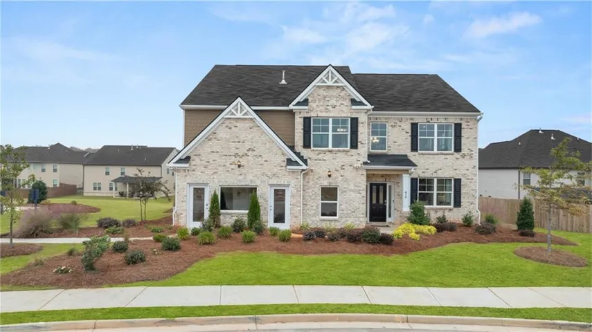 Craftsman-style home with brick siding