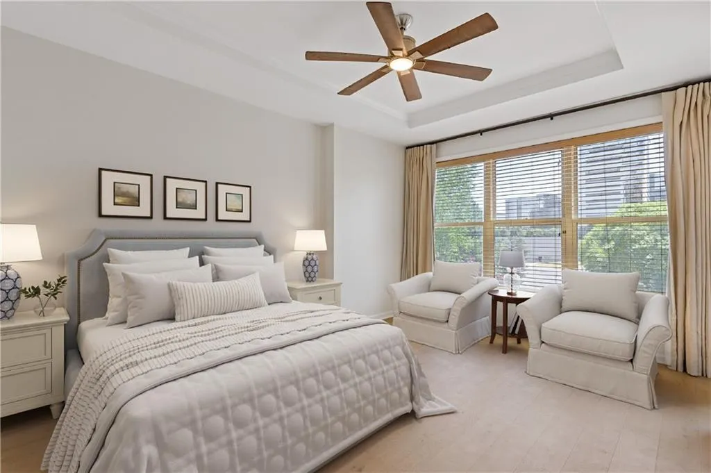 Virtually Staged Bedroom with ceiling fan, wood finished floors