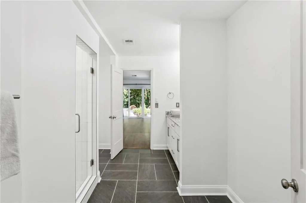 Master bathroom looking towards bedroom and adjoining patio.