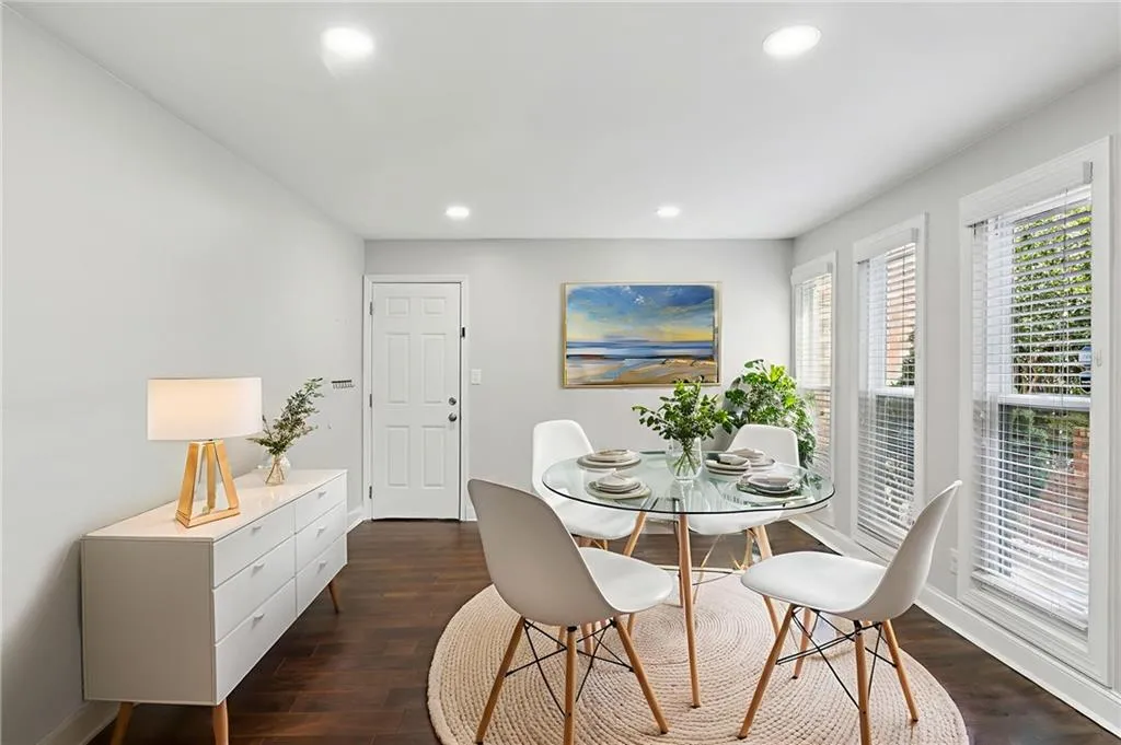Sunny breakfast room with full length windows.  Virtually staged.