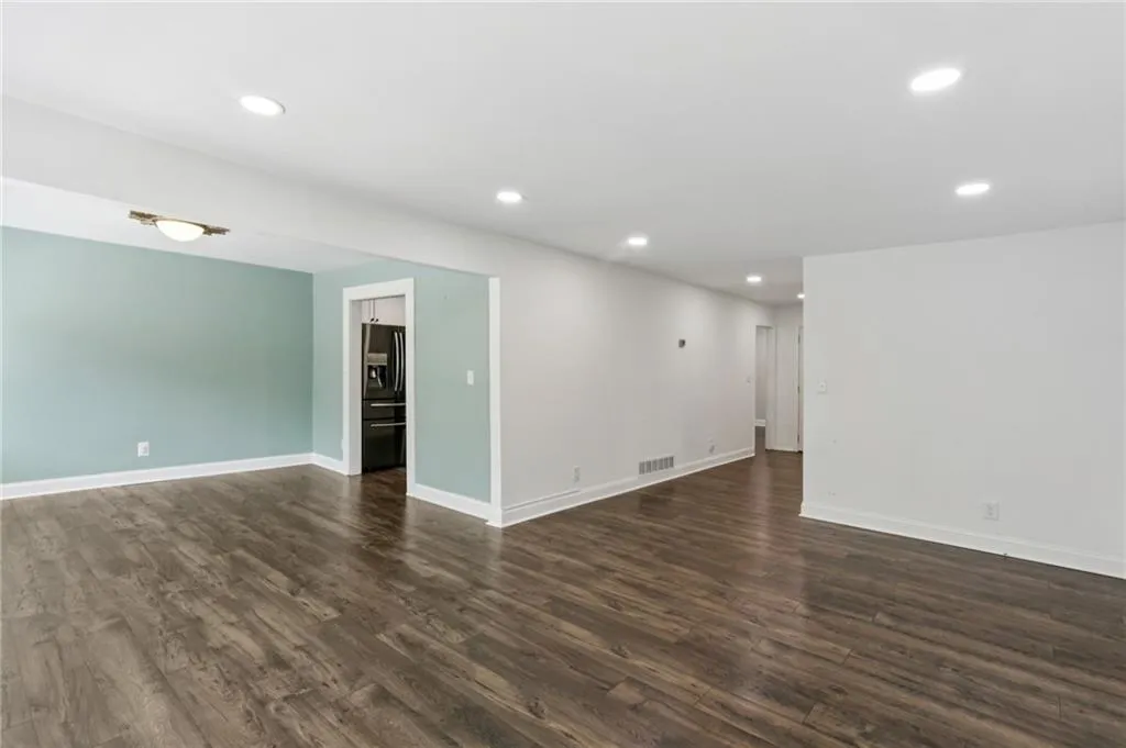 Living room towards dining room and entry foyer.