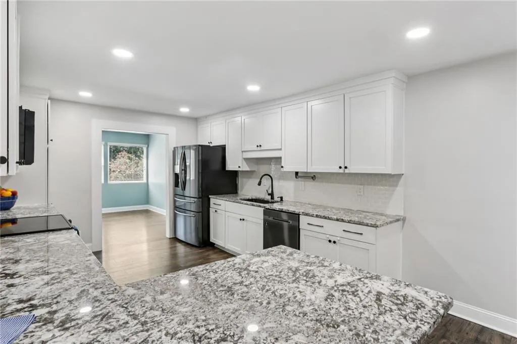 Large kitchen with granite counters, updated appliances and brand new microwave.