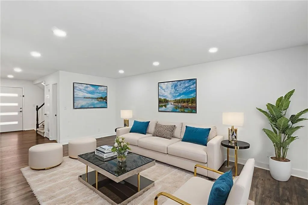 Spacious living room with hardwood floors.  Virtually staged.