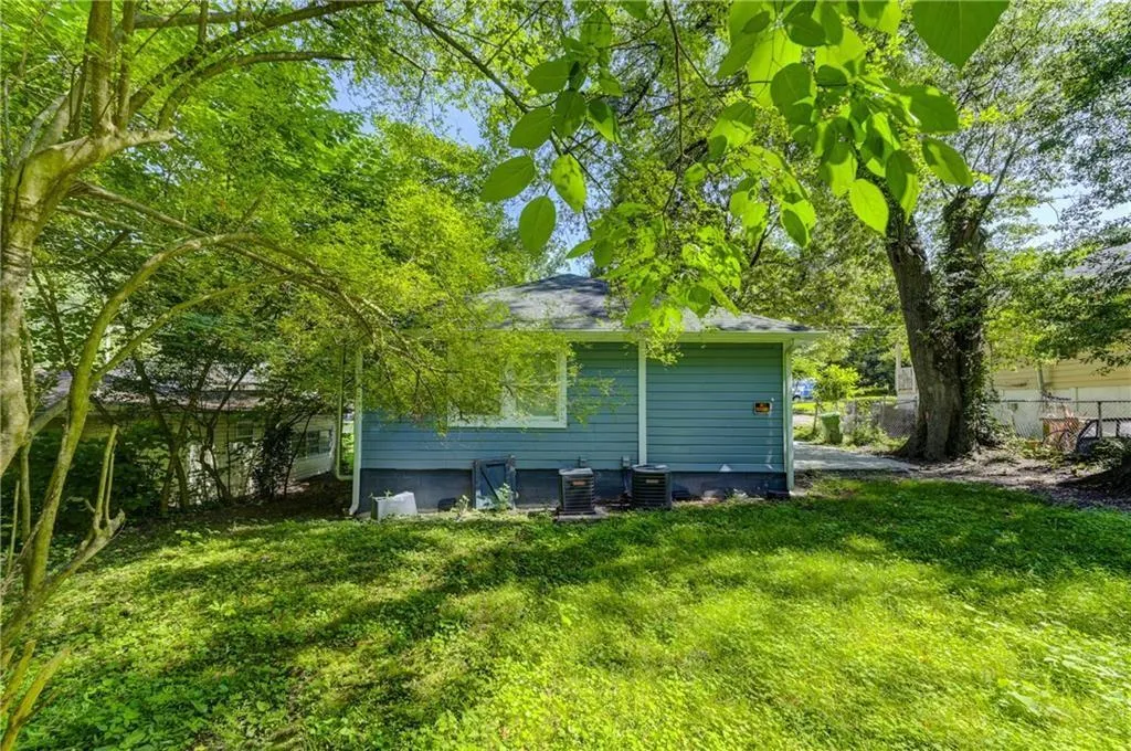 View of side of property featuring a cooling unit