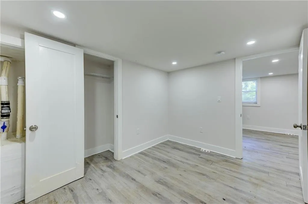 Unfurnished bedroom with light wood finished floors, recessed lighting, and a closet