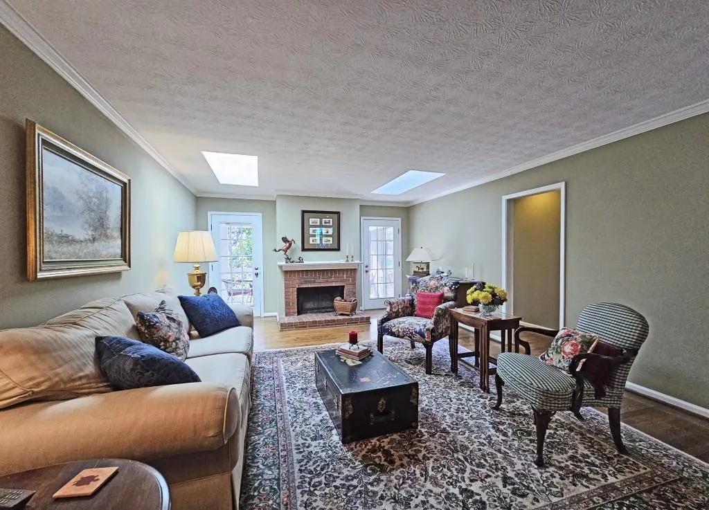 Living room with sky lights and Hardwood Floors