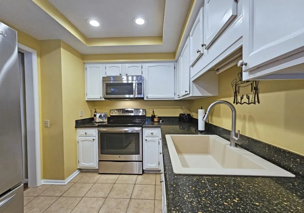Kitchen has Stainless Steel Appliances & Granite Counters