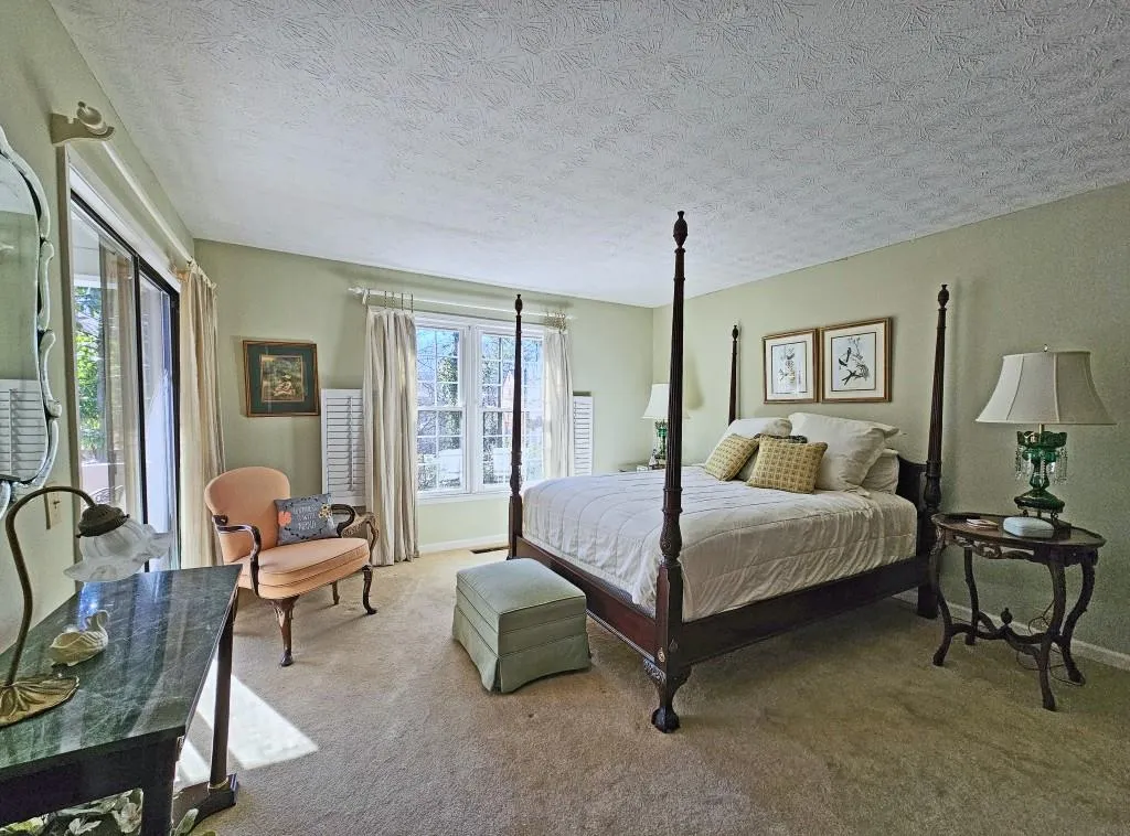 Primary Bedroom on Main Level with new carpeting installed after this photo