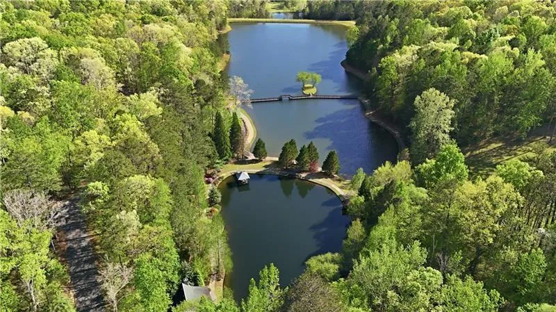 Two serene lakes surrounded by lush, mature trees