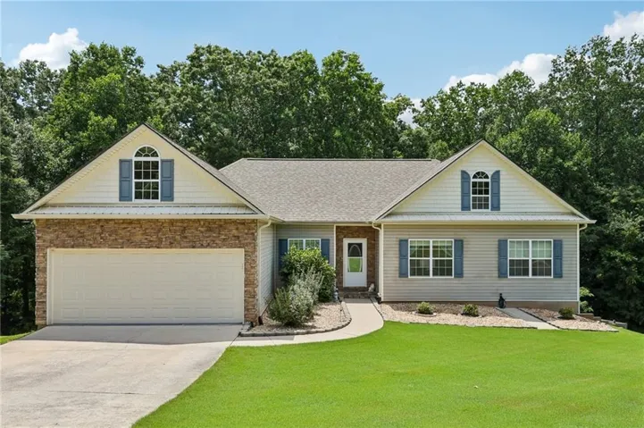 Ranch-style exterior with a stone facade accent
