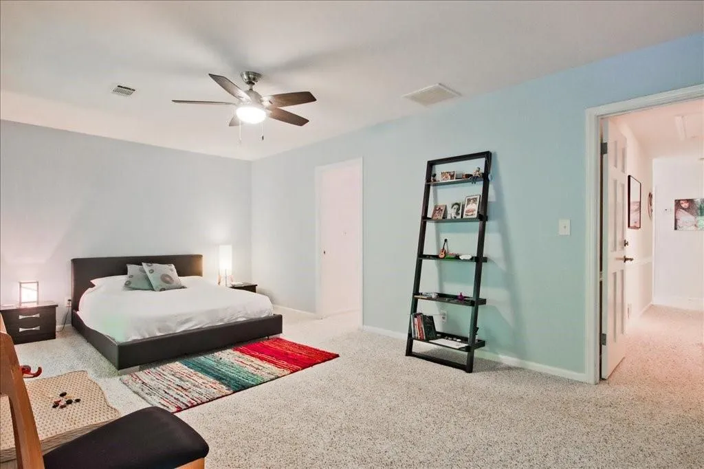 Bedroom with carpet floors and ceiling fan