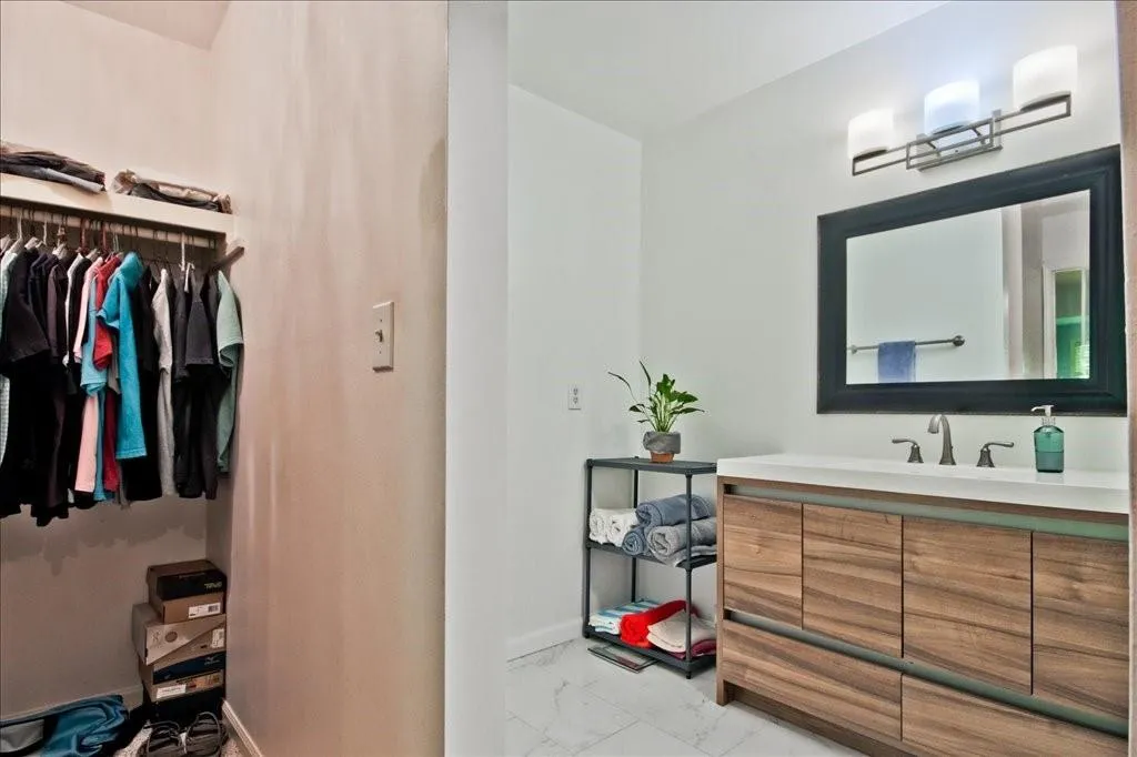 Bathroom with tile flooring and vanity