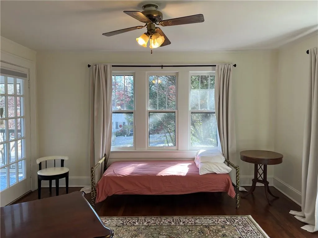 Bedroom with wood finished floors and a ceiling fan