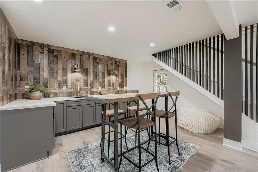 Dining space featuring recessed lighting, stairs, and light wood finished floors