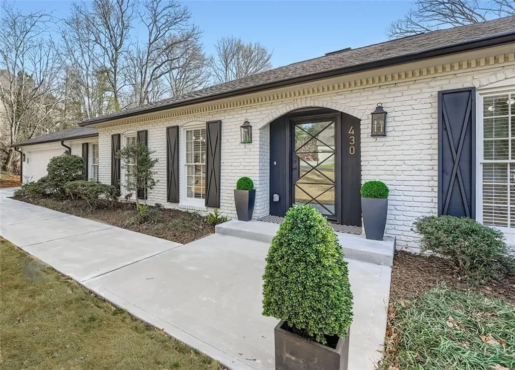 Property entrance featuring brick siding