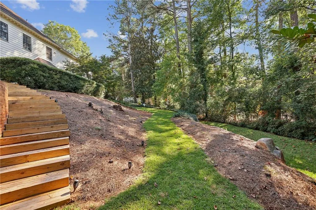 The next few shots of the back yard show how it is terraced to a flat area.  This is where the pool design fits perfectly.  Virtually staged pool shots at the end.